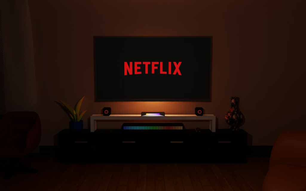 Netflix playing on a TV in a dark living room, representing a subscription that feels like background